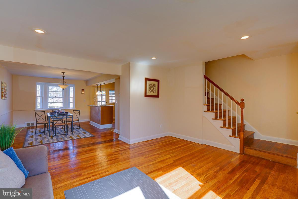 1434 Stonewood Road Baltimore, MD 21239 - Photo 9 of 28 a view of a livingroom with furniture wooden floor and windows