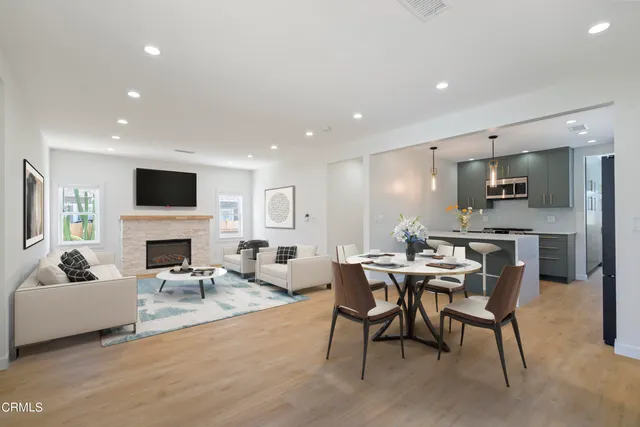 a living room with fireplace furniture and a flat screen tv