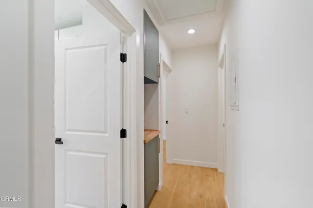 a view of a hallway with a white walls