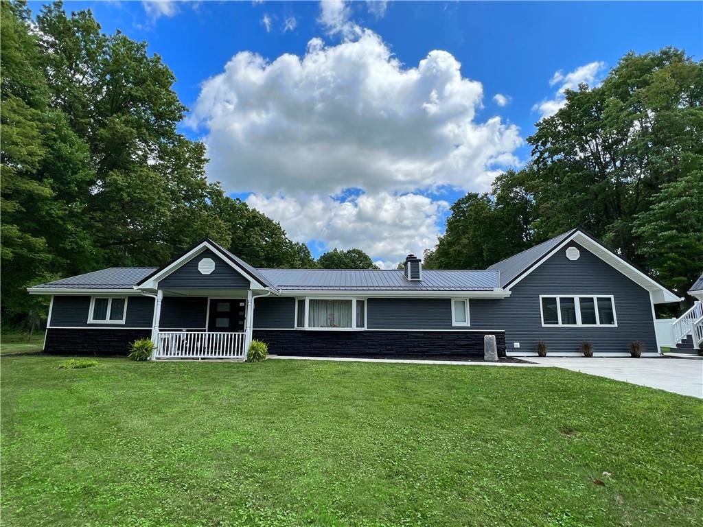 92 Blom Road Grove City, PA 16127 - Photo 1 of 28 a front view of a house with a garden