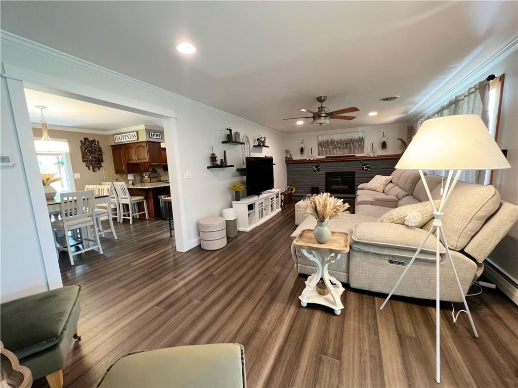 92 Blom Road Grove City, PA 16127 - Photo 12 of 28 a living room with furniture a flat screen tv and kitchen view