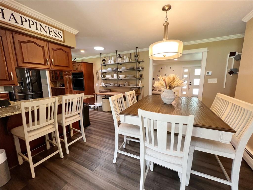 92 Blom Road Grove City, PA 16127 - Photo 15 of 28 a view of a dining room with furniture and wooden floor