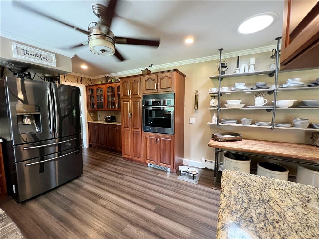 92 Blom Road Grove City, PA 16127 - Photo 17 of 28 a kitchen with stainless steel appliances kitchen island granite countertop a refrigerator and a stove top oven