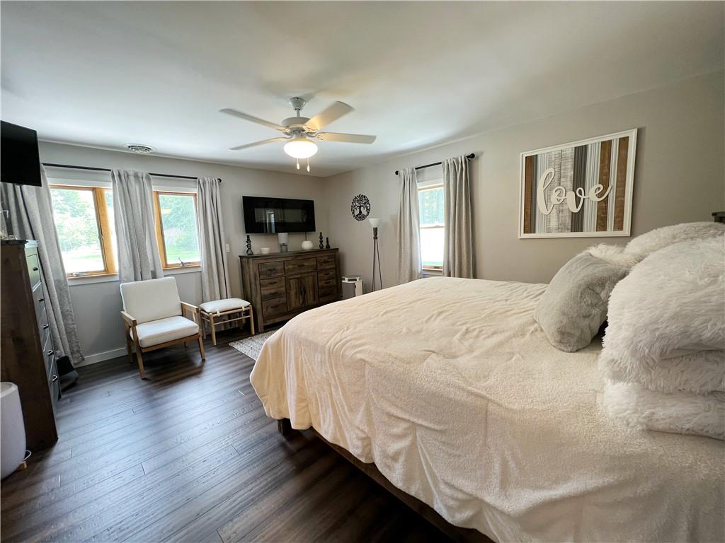92 Blom Road Grove City, PA 16127 - Photo 23 of 28 a spacious bedroom with a bed couch tv and a window