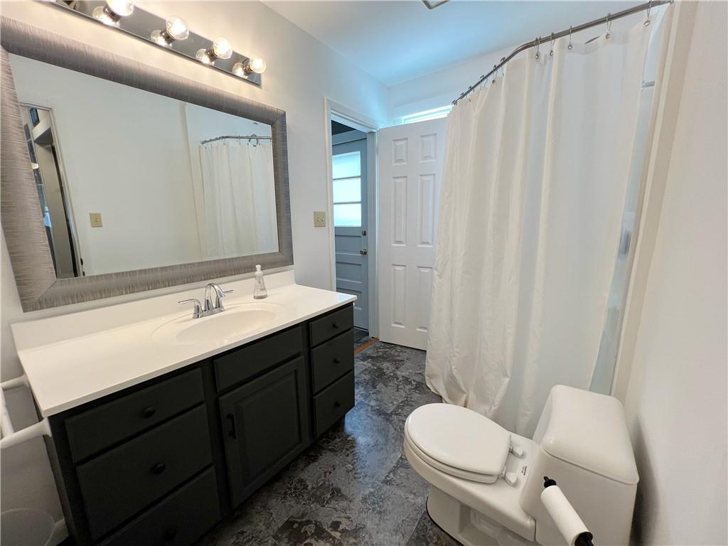92 Blom Road Grove City, PA 16127 - Photo 25 of 28 a bathroom with a toilet sink and mirror