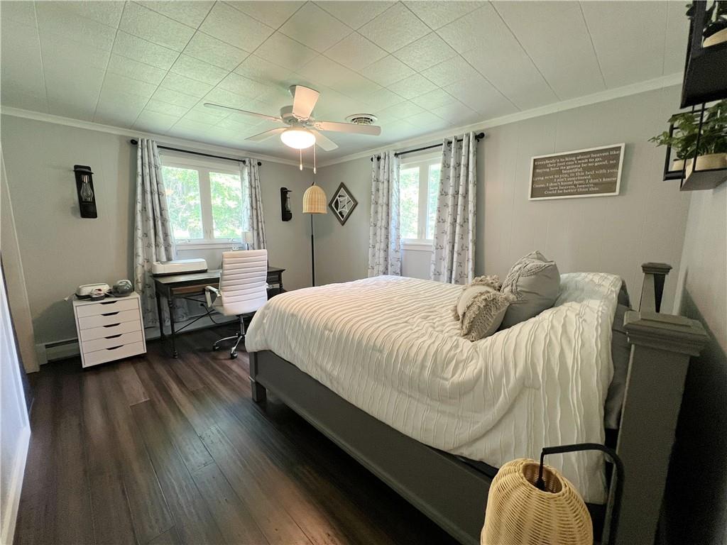 92 Blom Road Grove City, PA 16127 - Photo 26 of 28 a spacious bedroom with a bed and wooden floor