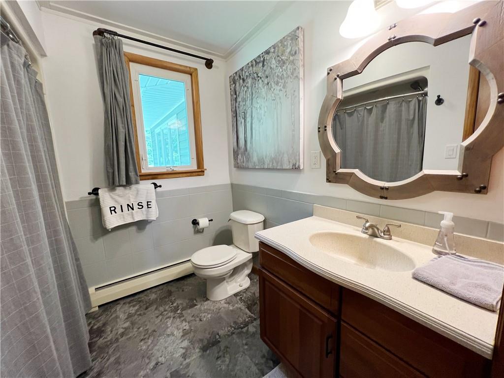 92 Blom Road Grove City, PA 16127 - Photo 28 of 28 a bathroom with a sink a toilet and a mirror