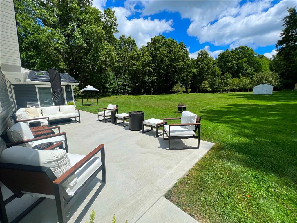 92 Blom Road Grove City, PA 16127 - Photo 4 of 28 a view of a patio with couches chairs and a yard