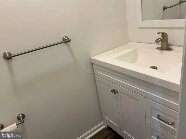 a bathroom with a sink and vanity