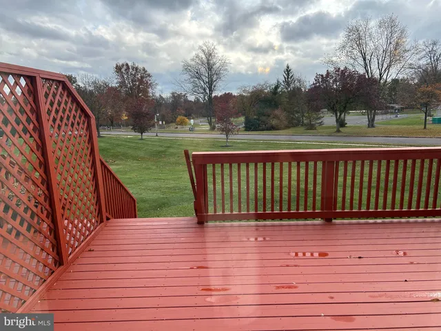 a view of deck with wooden floor and fence