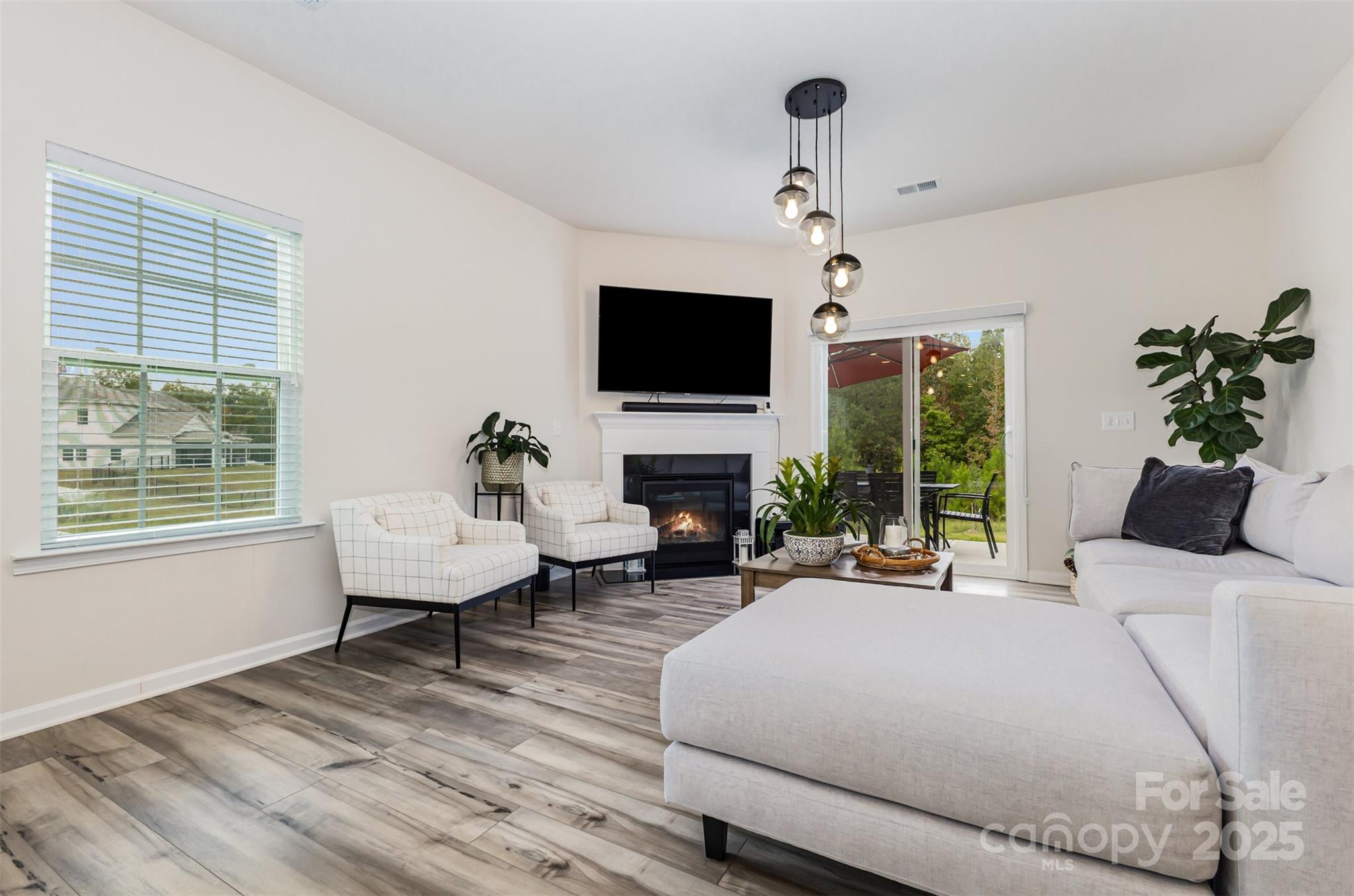 5841 Soft Shell Drive Lancaster, SC 29720 - Photo 14 of 46 a bedroom with a bed a flat screen tv and a couch