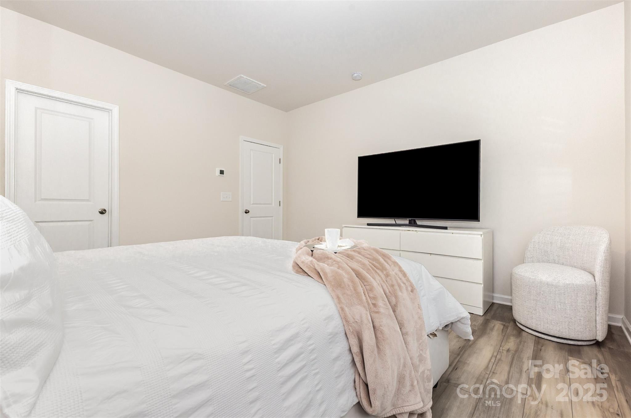5841 Soft Shell Drive Lancaster, SC 29720 - Photo 18 of 46 a bedroom with a bed and a flat screen tv