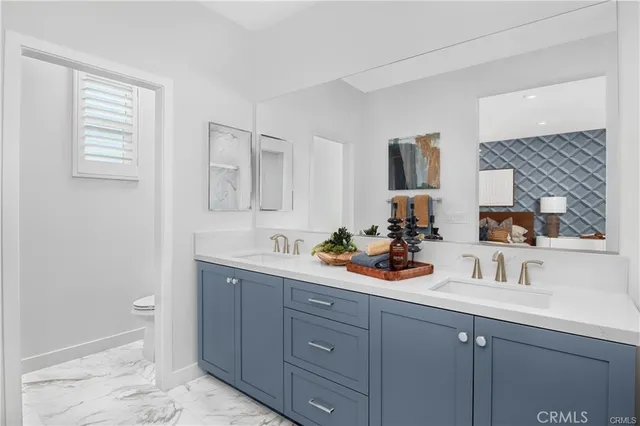 a view of bathroom with sink and mirror