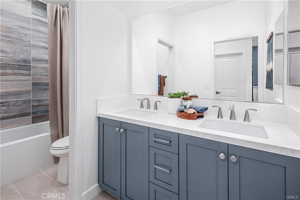 22060 Florence Circle Walnut, CA 91789 - Photo 15 of 16 a bathroom with a sink and a mirror