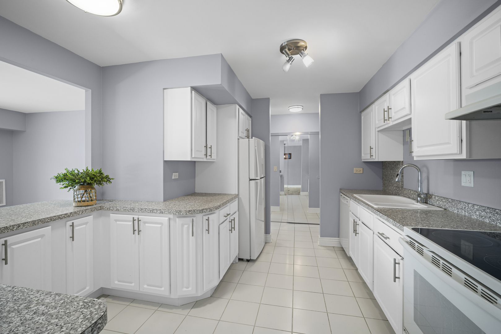 1615 East Central Road, Unit 417C Arlington Heights, IL 60005 - Photo 11 of 24 a kitchen with stainless steel appliances a sink stove and cabinets