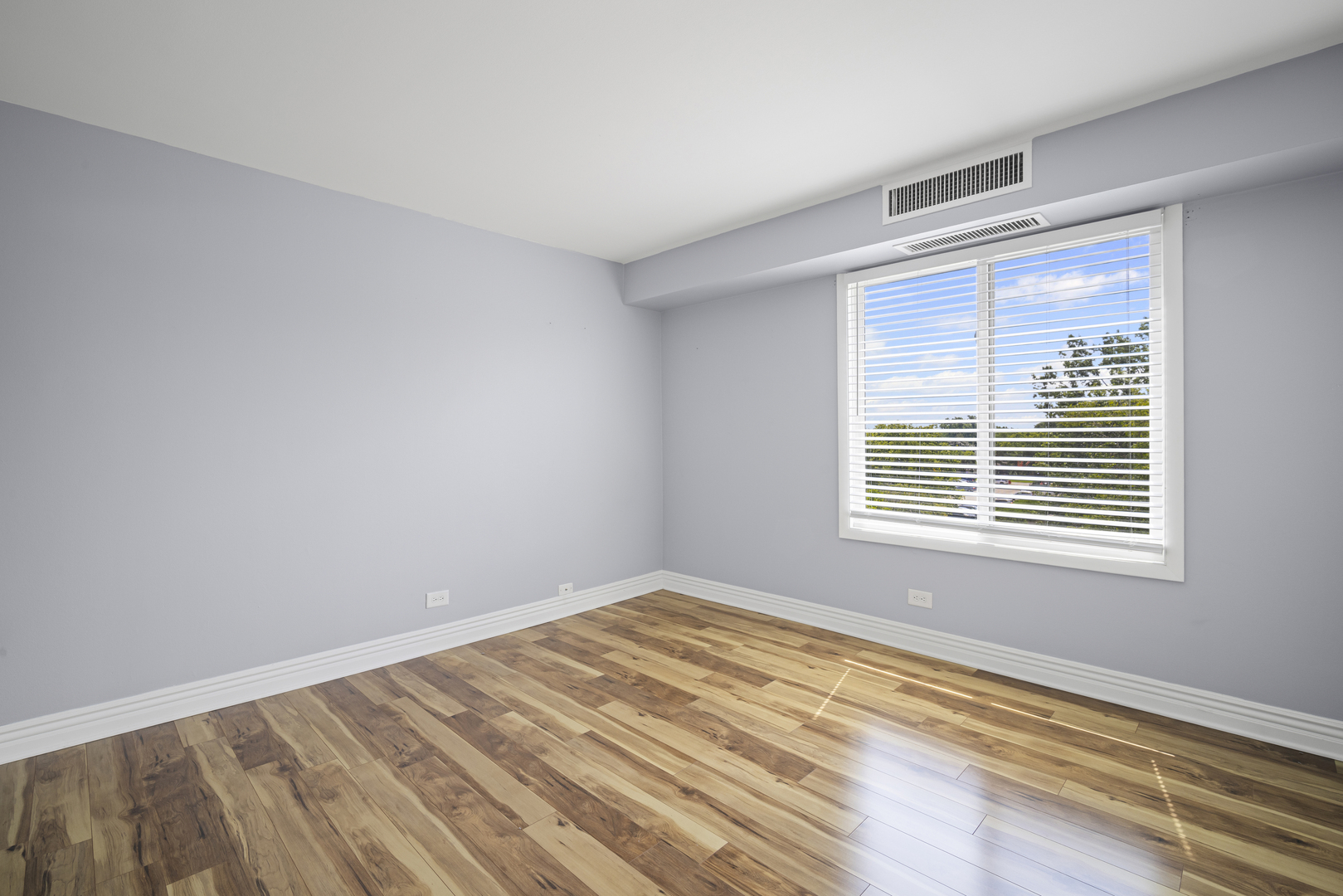 1615 East Central Road, Unit 417C Arlington Heights, IL 60005 - Photo 13 of 24 a view of an empty room with a window