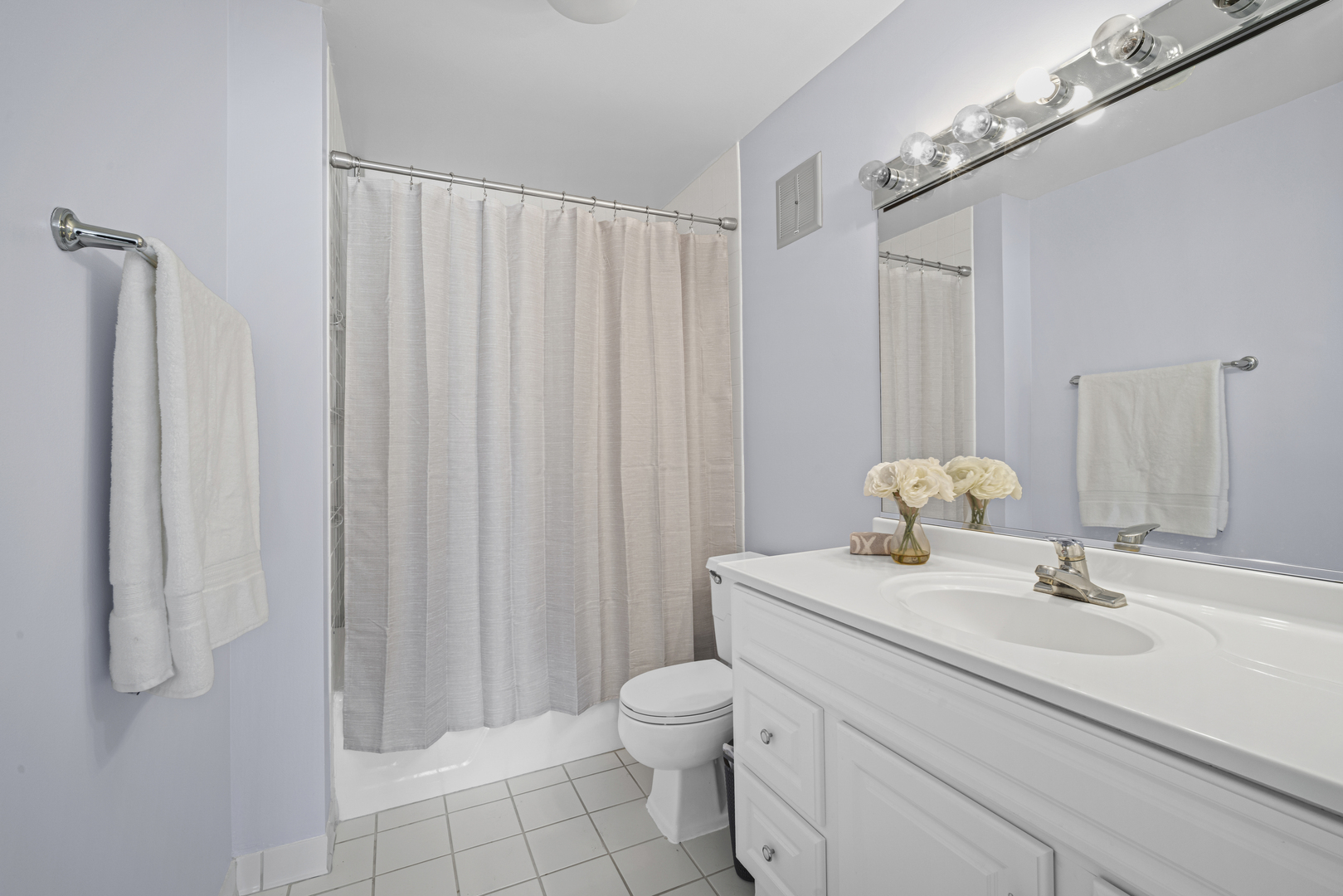 1615 East Central Road, Unit 417C Arlington Heights, IL 60005 - Photo 18 of 24 a bathroom with a sink vanity granite and toilet