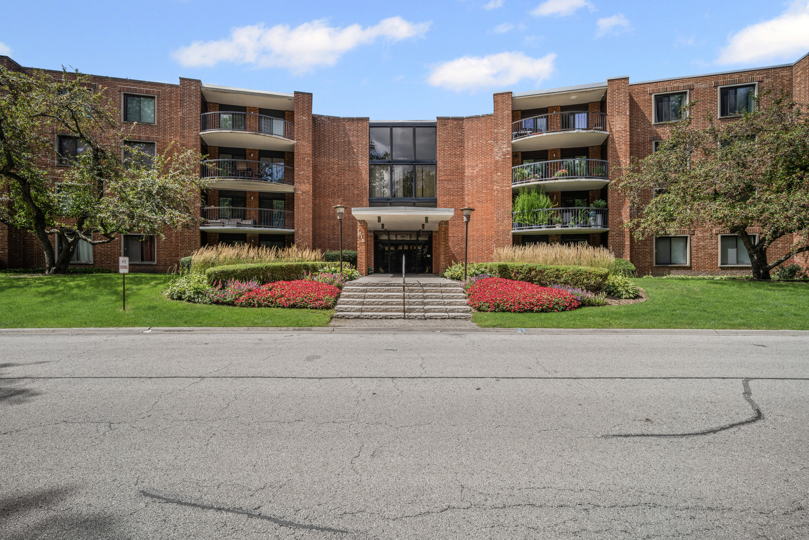 1615 East Central Road, Unit 417C Arlington Heights, IL 60005 - Photo 24 of 24 a view of front a house with a yard