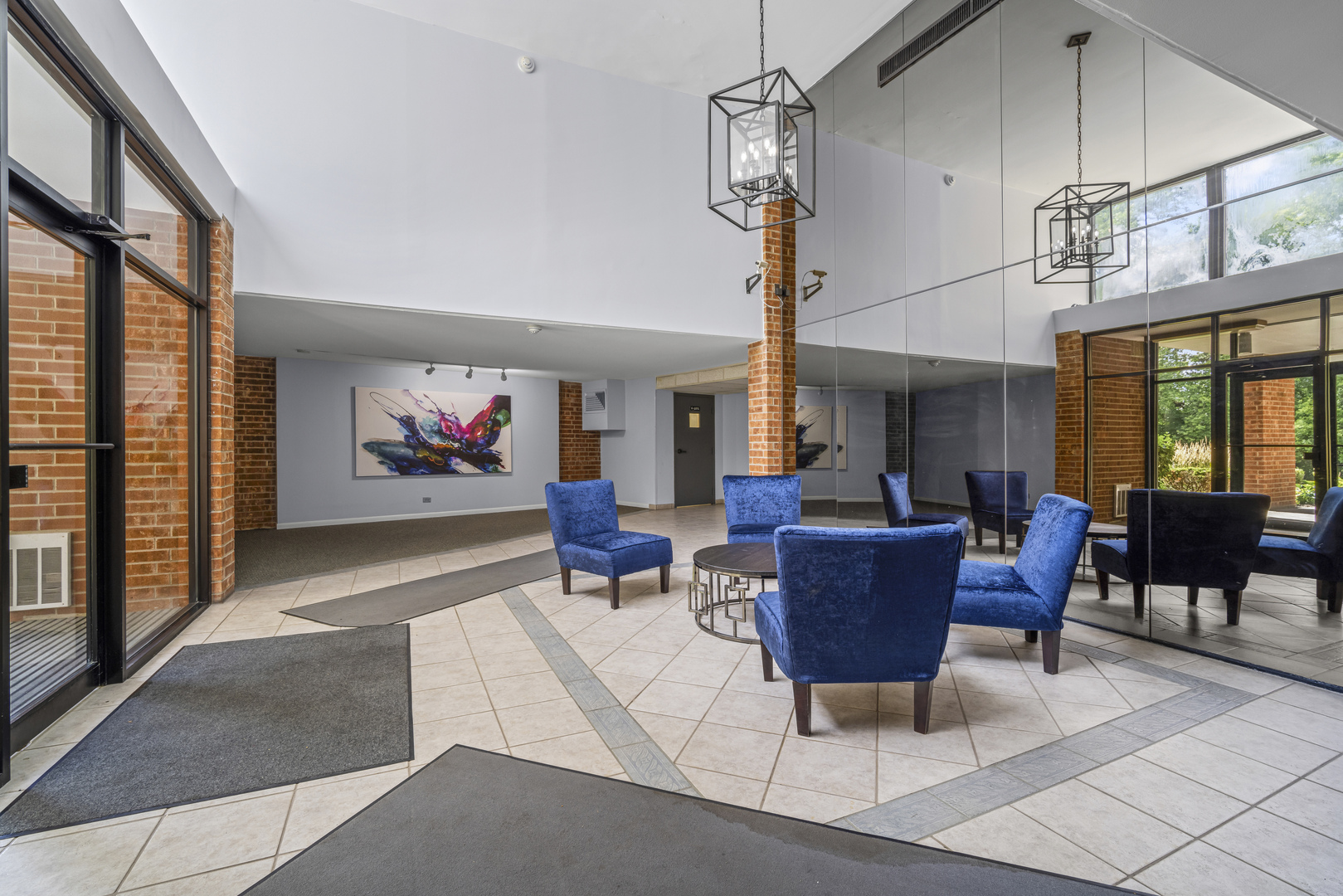 1615 East Central Road, Unit 417C Arlington Heights, IL 60005 - Photo 3 of 24 a living room with furniture a window and a table
