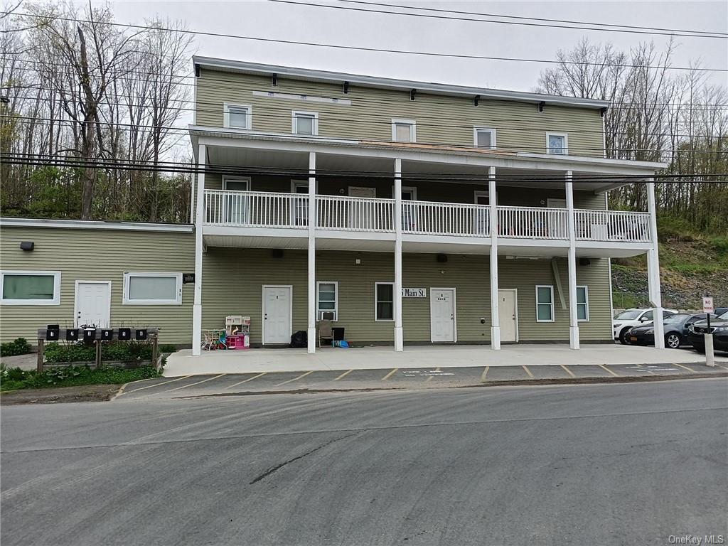 6 Main Street Sparrowbush, NY 12780 - Photo 1 of 22 a front view of a building with a lots of windows and plants