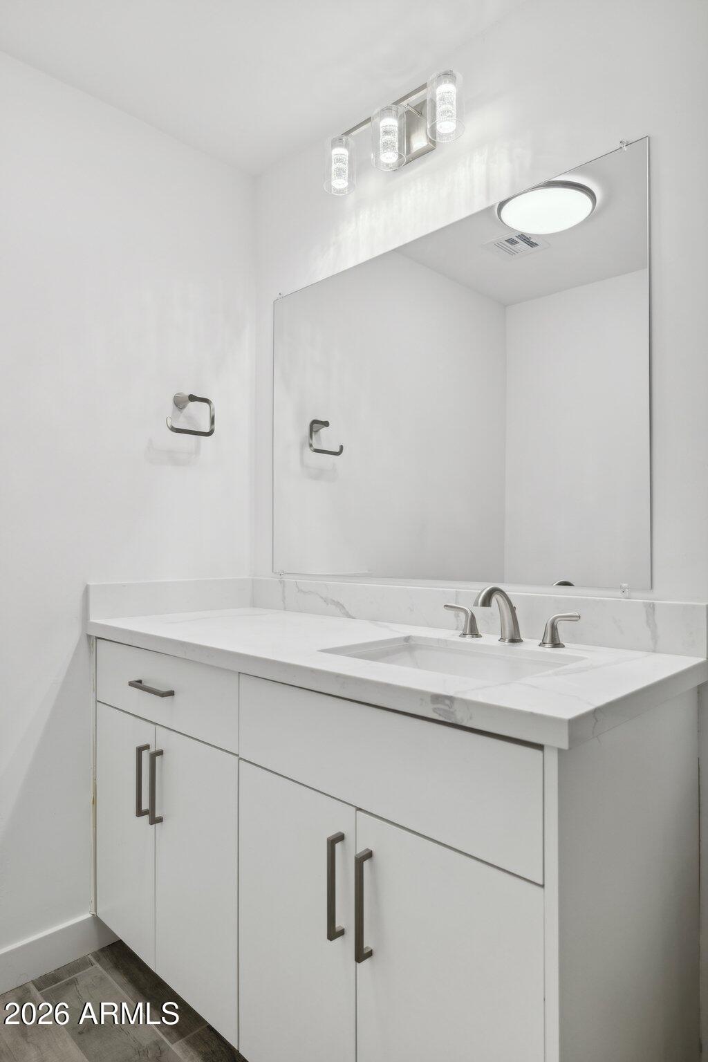 4144 North 36th Street Phoenix, AZ 85018 - Photo 14 of 30 a bathroom with a sink and a mirror