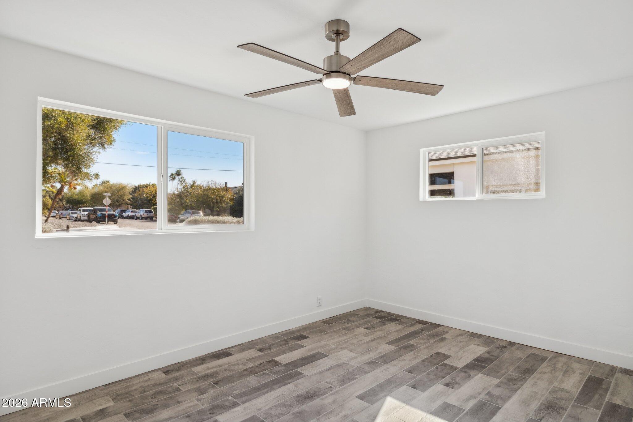 4144 North 36th Street Phoenix, AZ 85018 - Photo 23 of 30 a view of empty room with wooden floor