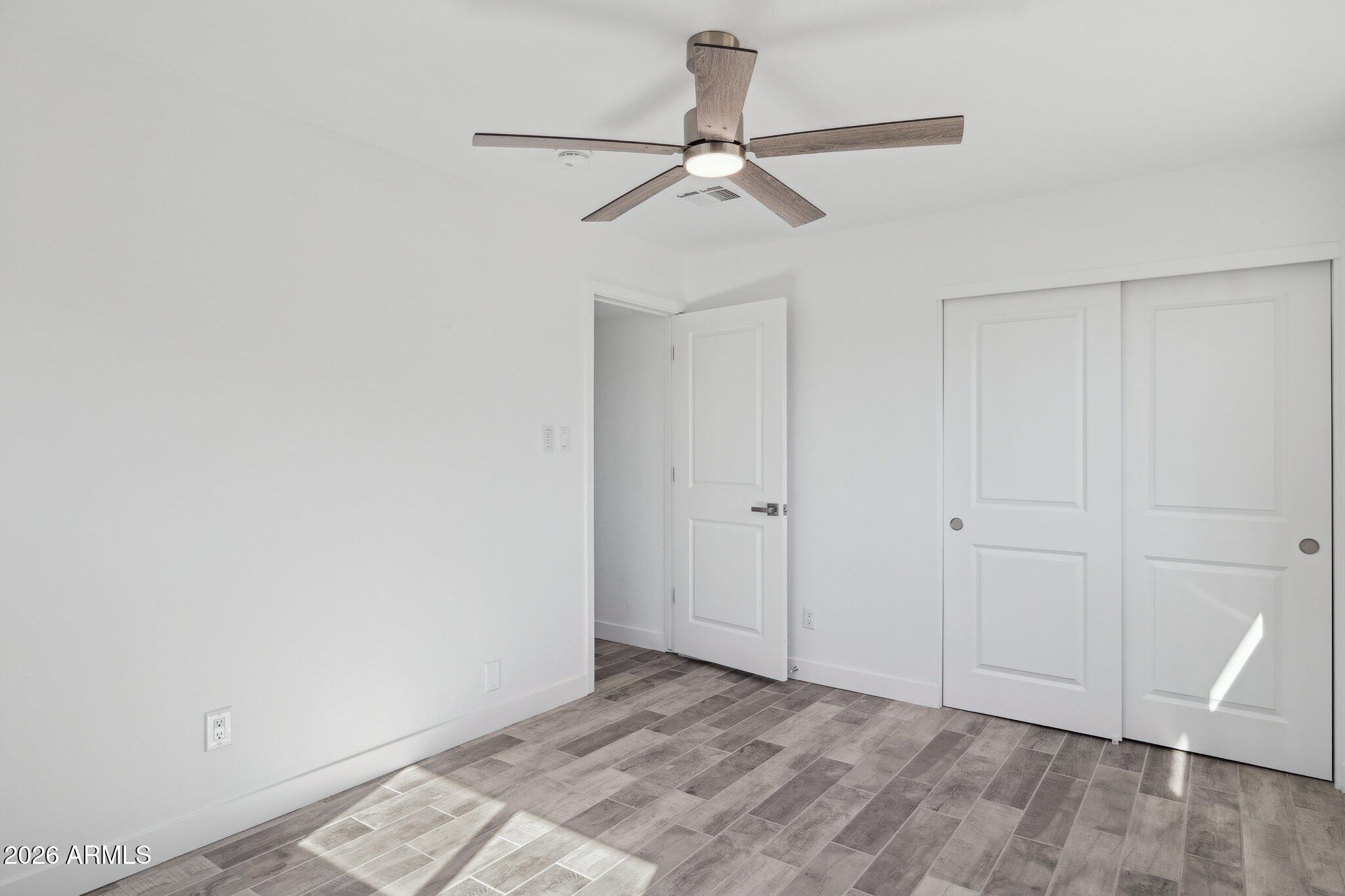 4144 North 36th Street Phoenix, AZ 85018 - Photo 24 of 30 a view of a room with a ceiling fan