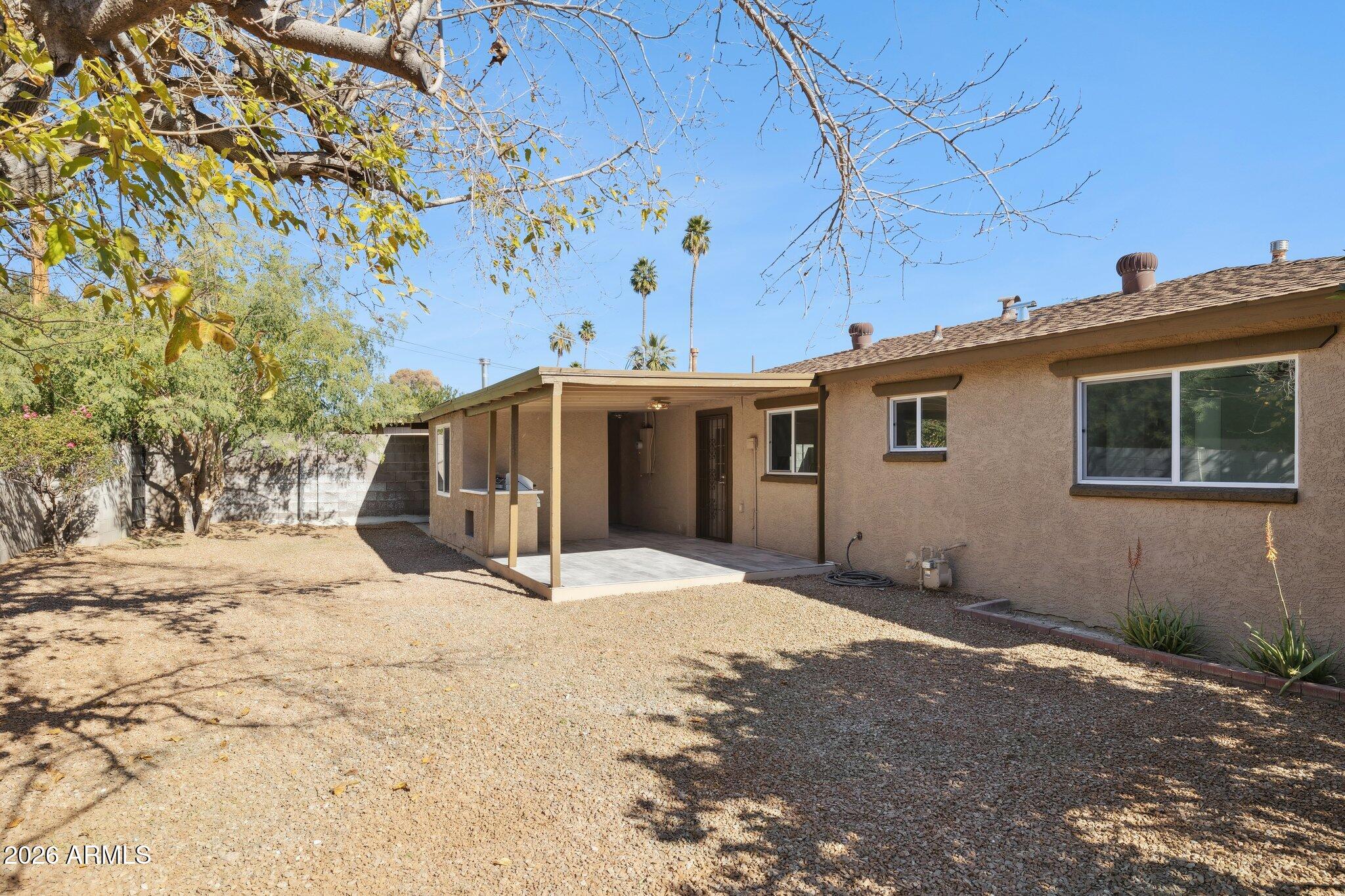 4144 North 36th Street Phoenix, AZ 85018 - Photo 28 of 30 a view of a house with a yard