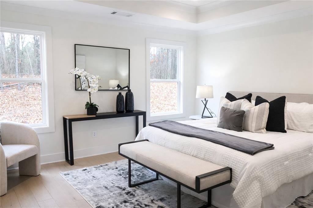 2635 Radvell Court Decatur, GA 30034 - Photo 11 of 19 a bedroom with a bed a mirror and a window