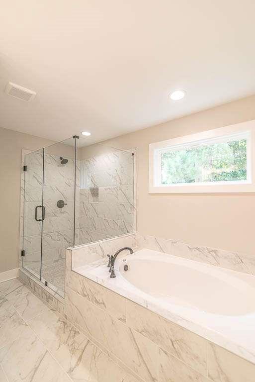 2635 Radvell Court Decatur, GA 30034 - Photo 15 of 19 a bathroom with a bathtub and a shower