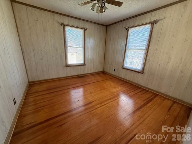 2041 Clyde Street Dallas, NC 28034 - Photo 15 of 46 a view of an empty room with a window and wooden floor