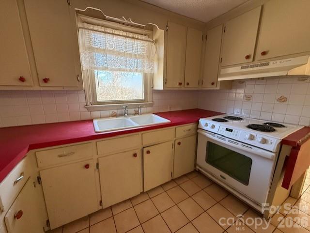 2041 Clyde Street Dallas, NC 28034 - Photo 18 of 46 a kitchen with cabinets appliances and a window