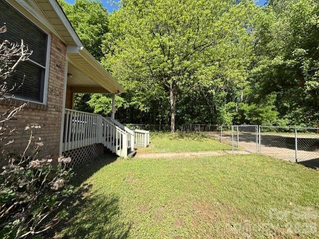 2041 Clyde Street Dallas, NC 28034 - Photo 41 of 46 a view of a backyard with a small cabin