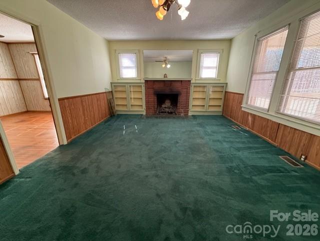 2041 Clyde Street Dallas, NC 28034 - Photo 5 of 46 wooden floor in an empty room with a fireplace
