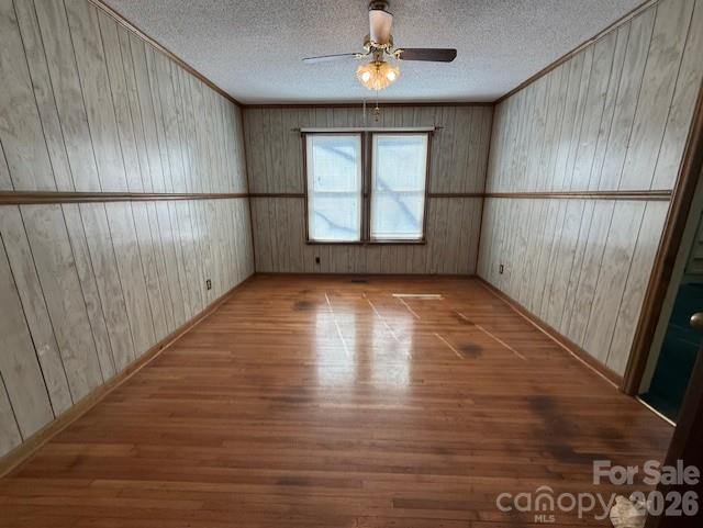 2041 Clyde Street Dallas, NC 28034 - Photo 6 of 46 en empty room with wooden floor and fan