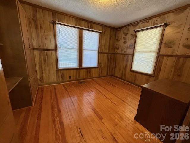 2041 Clyde Street Dallas, NC 28034 - Photo 10 of 46 a view of an empty room with wooden floor and a window