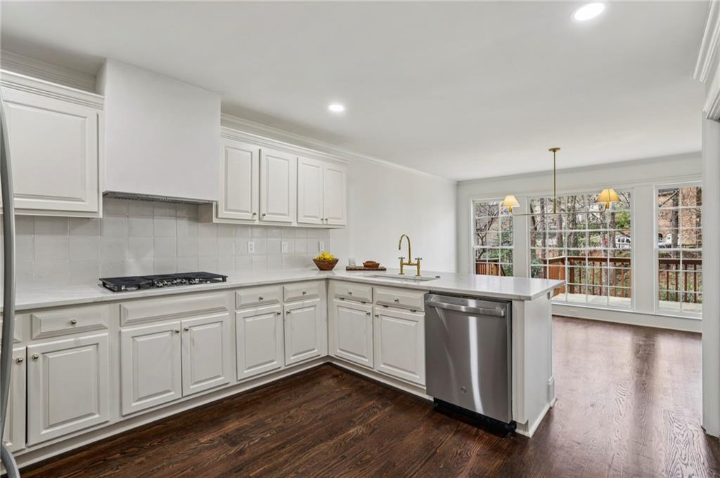 105 Inverness Approach Roswell, GA 30075 - Photo 21 of 51 a kitchen with a sink stove and cabinets