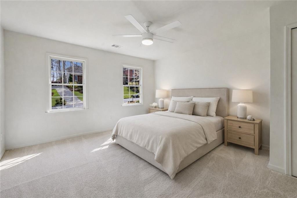 105 Inverness Approach Roswell, GA 30075 - Photo 30 of 51 a bed room with bed and a window