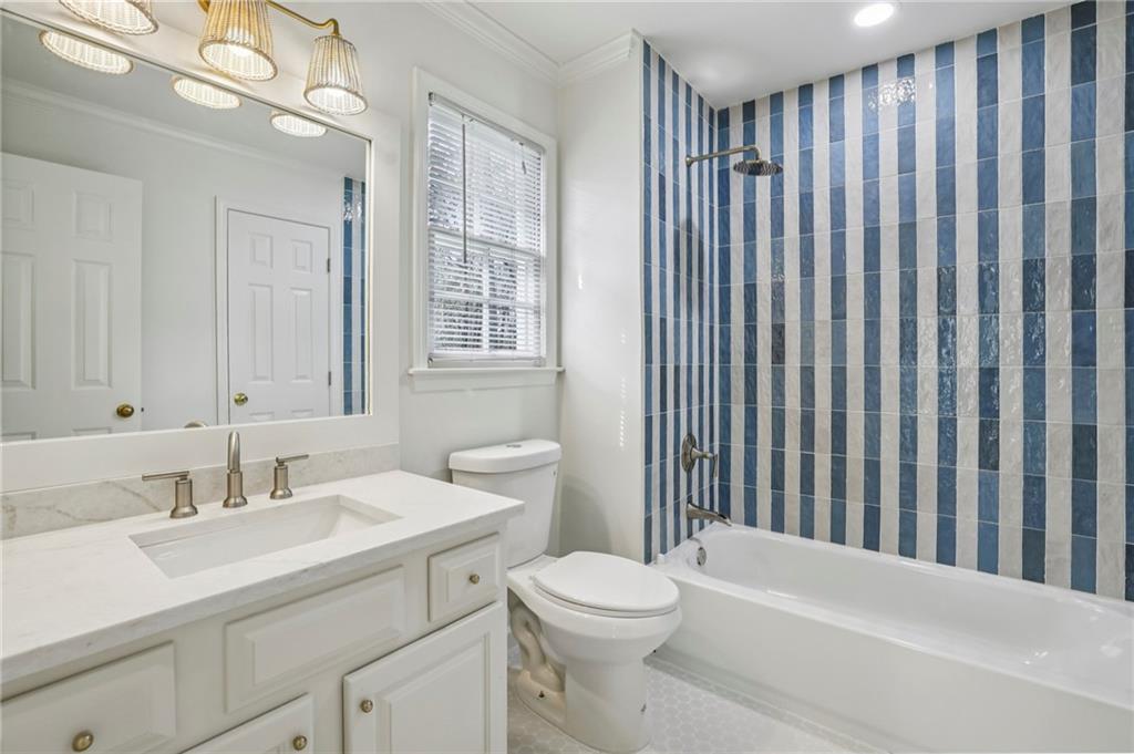 105 Inverness Approach Roswell, GA 30075 - Photo 31 of 51 a bathroom with a sink a toilet and shower