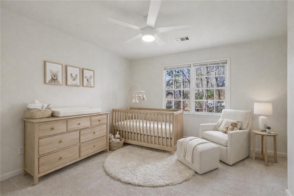105 Inverness Approach Roswell, GA 30075 - Photo 33 of 51 a bedroom with a bed and a window