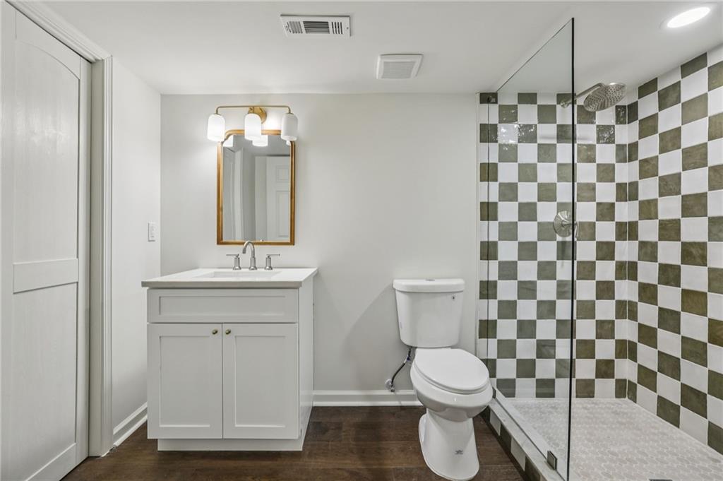 105 Inverness Approach Roswell, GA 30075 - Photo 38 of 51 a bathroom with a sink and a mirror
