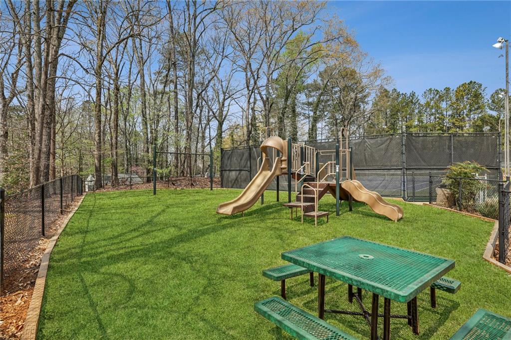105 Inverness Approach Roswell, GA 30075 - Photo 45 of 51 a view of a park with slide