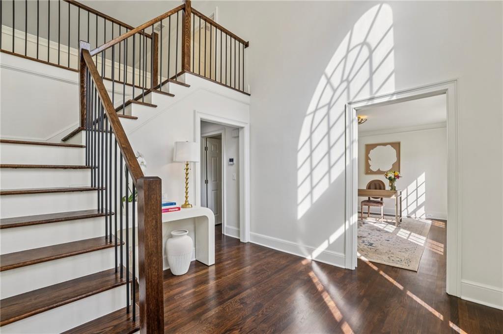 105 Inverness Approach Roswell, GA 30075 - Photo 7 of 51 a view of a hallway with wooden floor and staircase