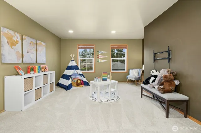 a bedroom with a bed and glass window