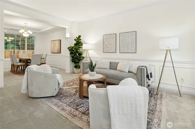 a living room with furniture and a lamp