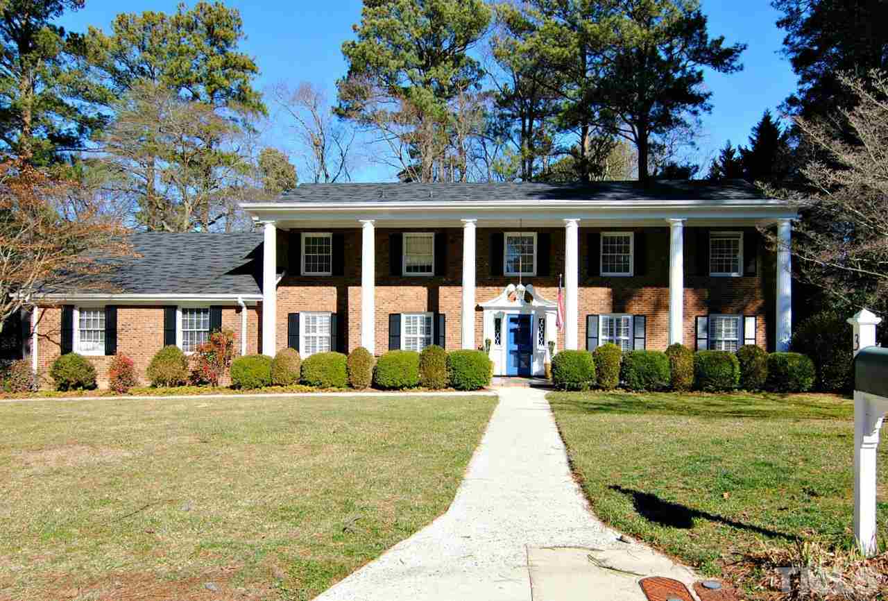 304 Foxhall Street Raleigh, NC 27609 - Photo 1 of 25 a front view of a house with a yard