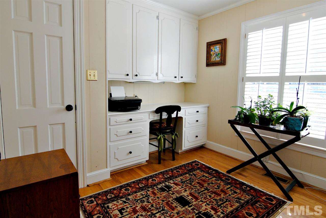 304 Foxhall Street Raleigh, NC 27609 - Photo 14 of 25 a view of a workspace with furniture and a window