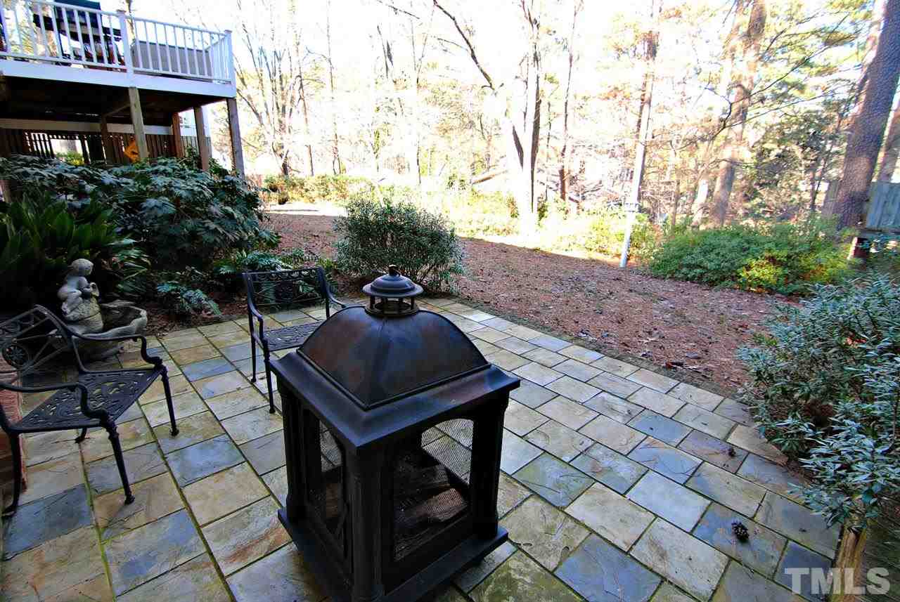 304 Foxhall Street Raleigh, NC 27609 - Photo 23 of 25 a view of a patio with table and chairs and potted plants