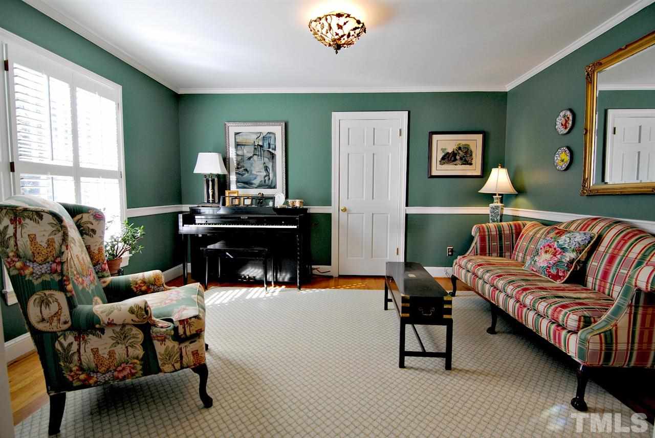 304 Foxhall Street Raleigh, NC 27609 - Photo 5 of 25 a living room with furniture and a large window