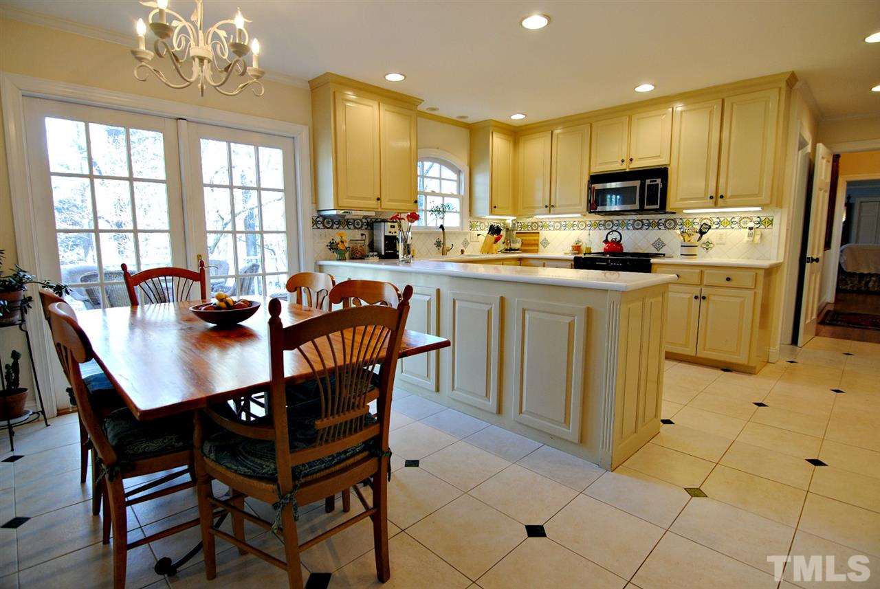 304 Foxhall Street Raleigh, NC 27609 - Photo 10 of 25 a view of a dining room with furniture window and outside view